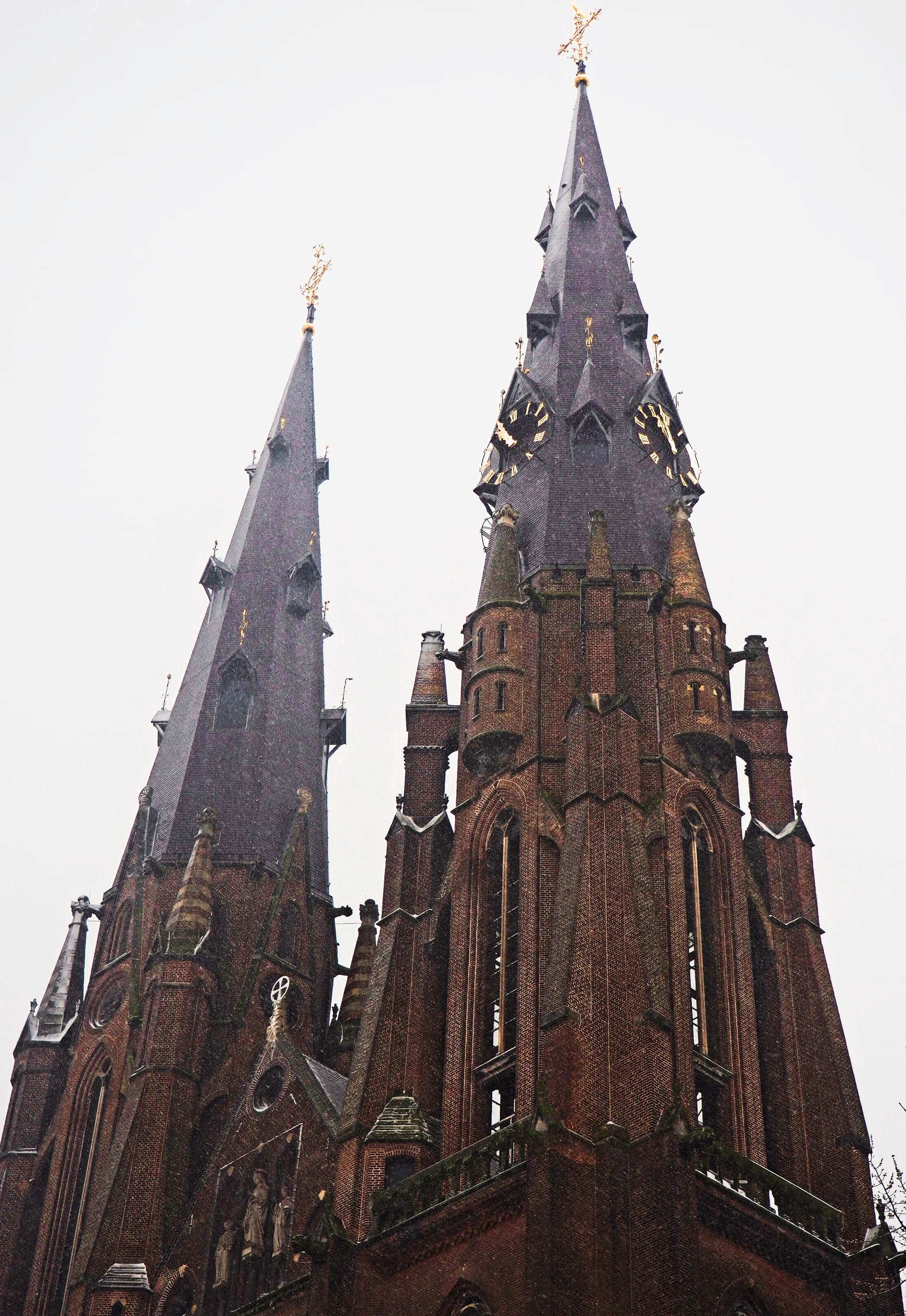 Twin Spires Rising Through Overcast Skies