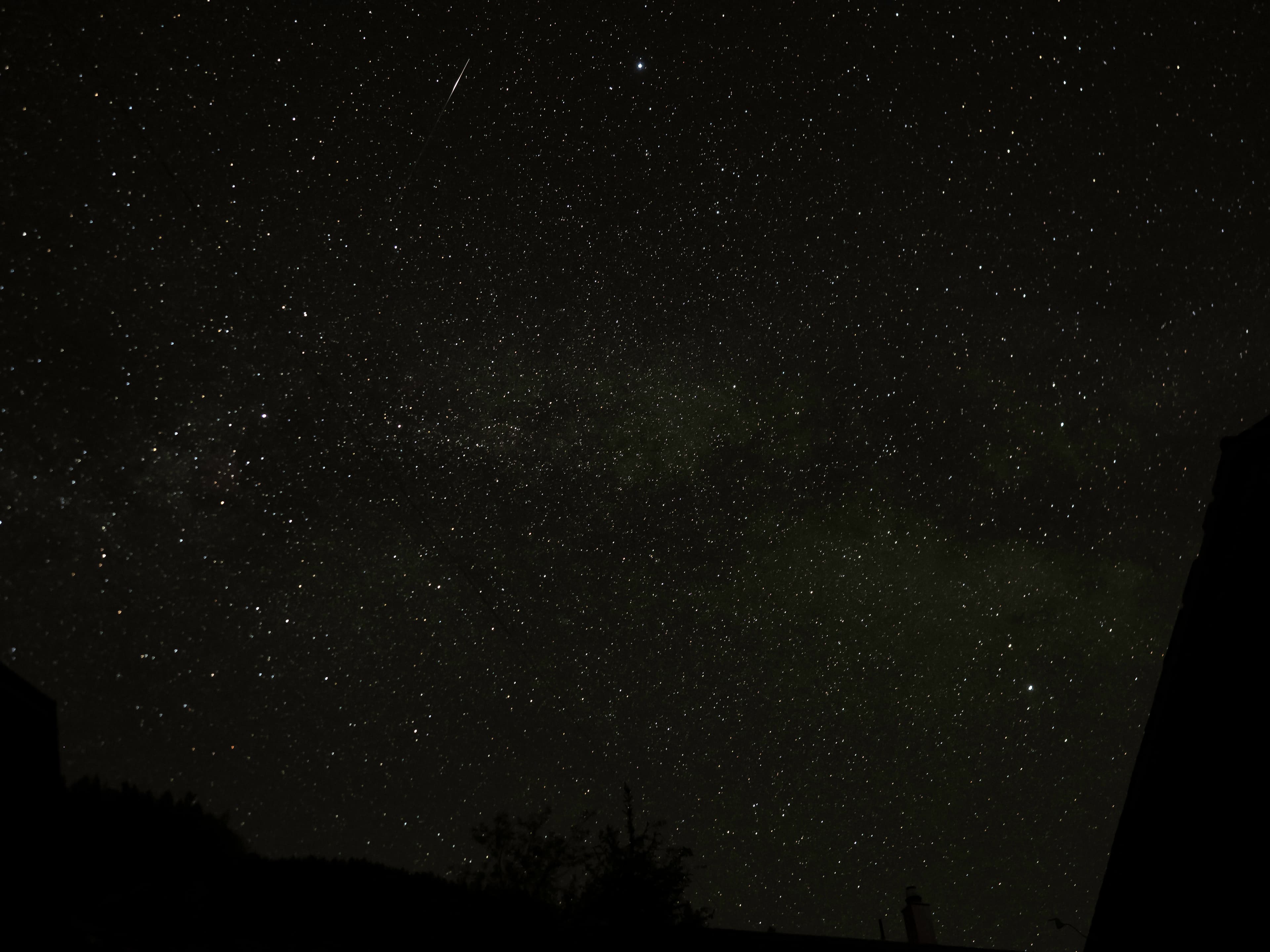 Meteor Streak Across a Starlit Sky