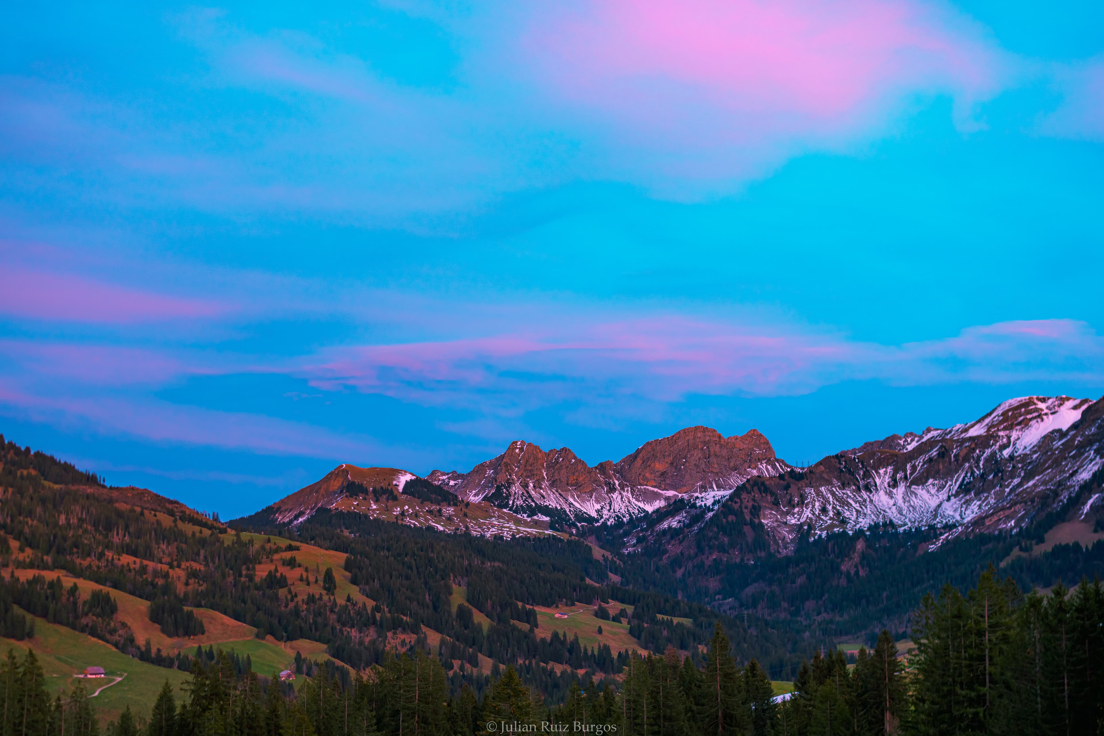 Alpine Twilight Over Snow Dusted Peaks