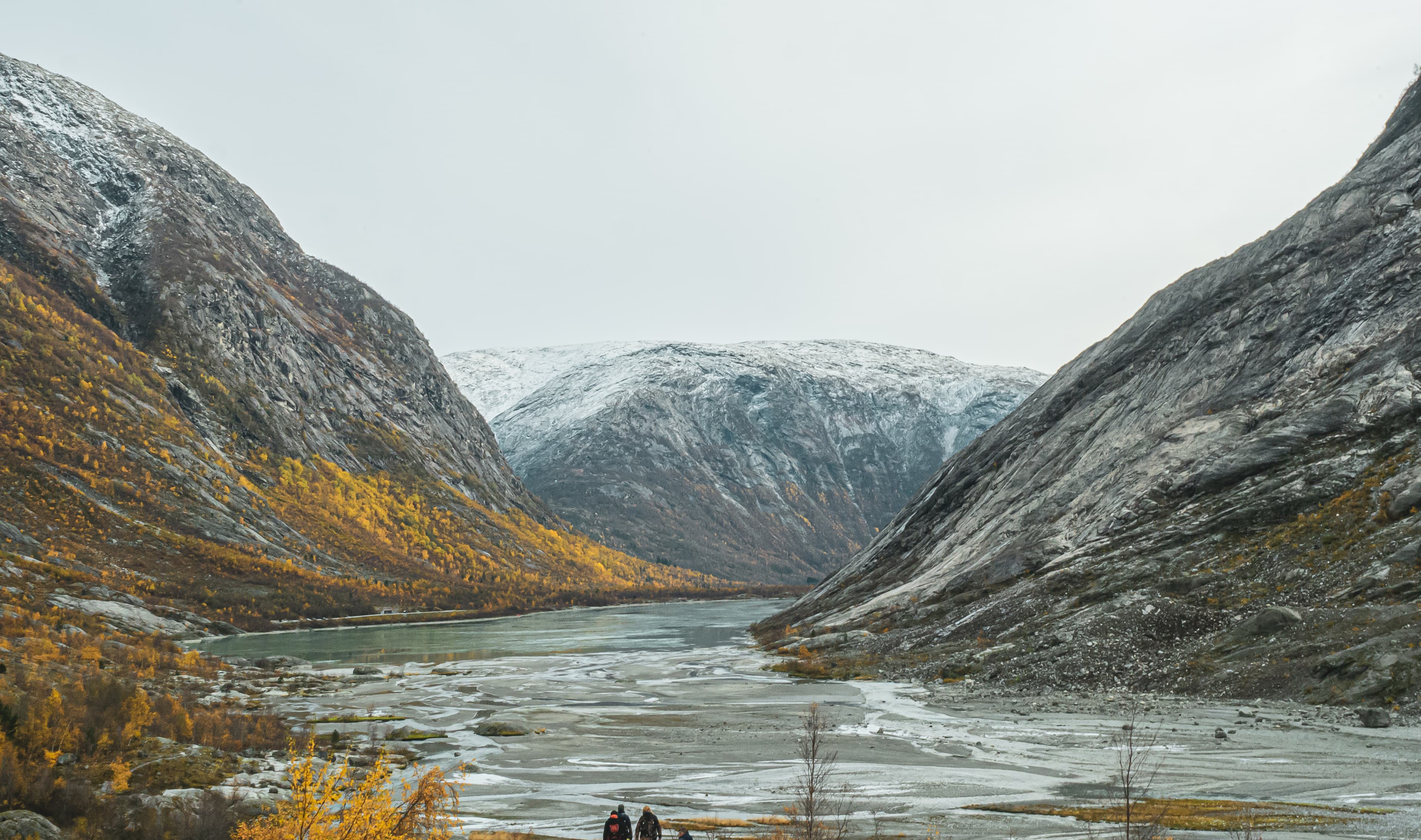 Autumn Valley Between Snow-Capped Peaks