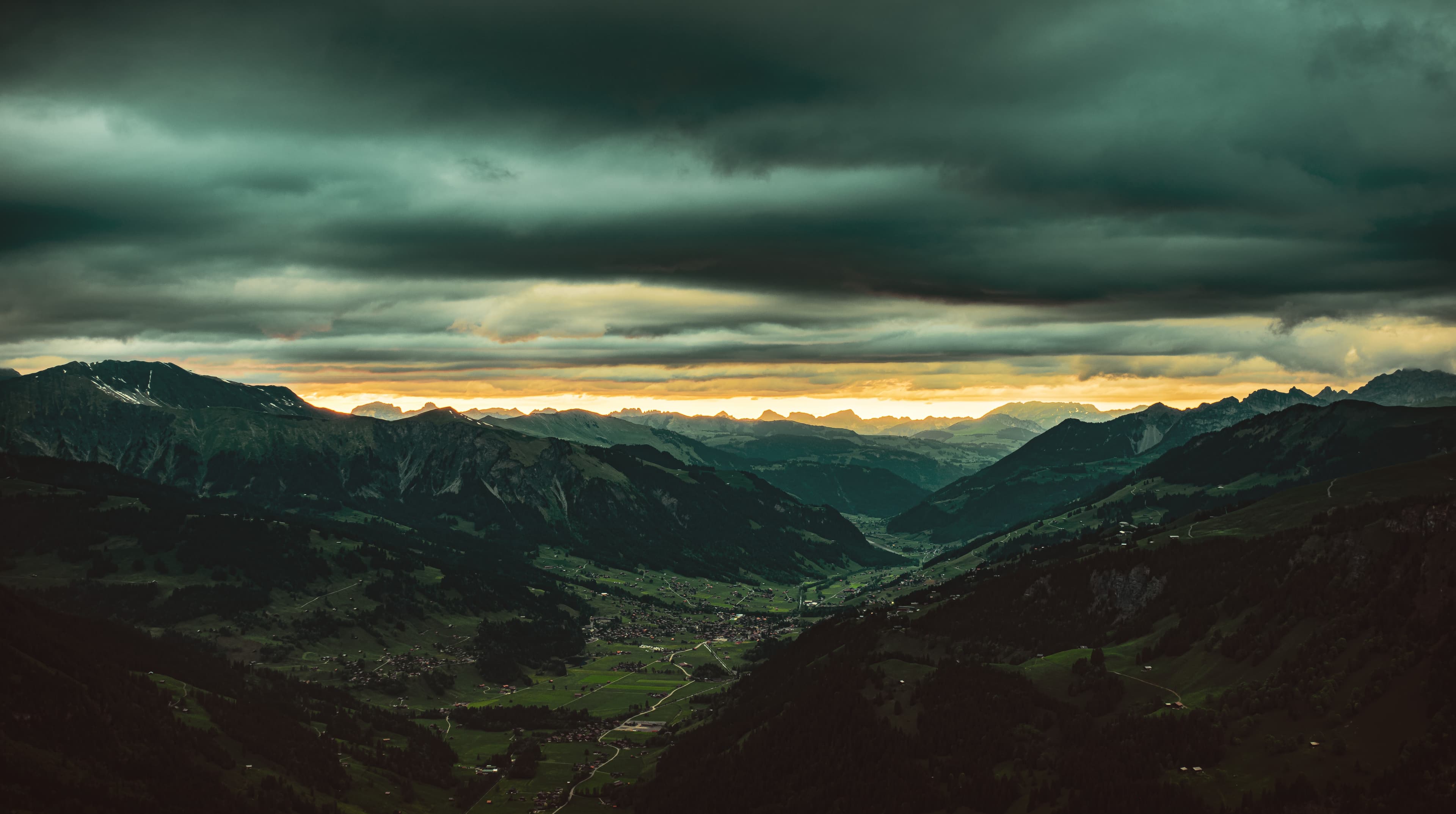Storm Light Over Alpine Valley