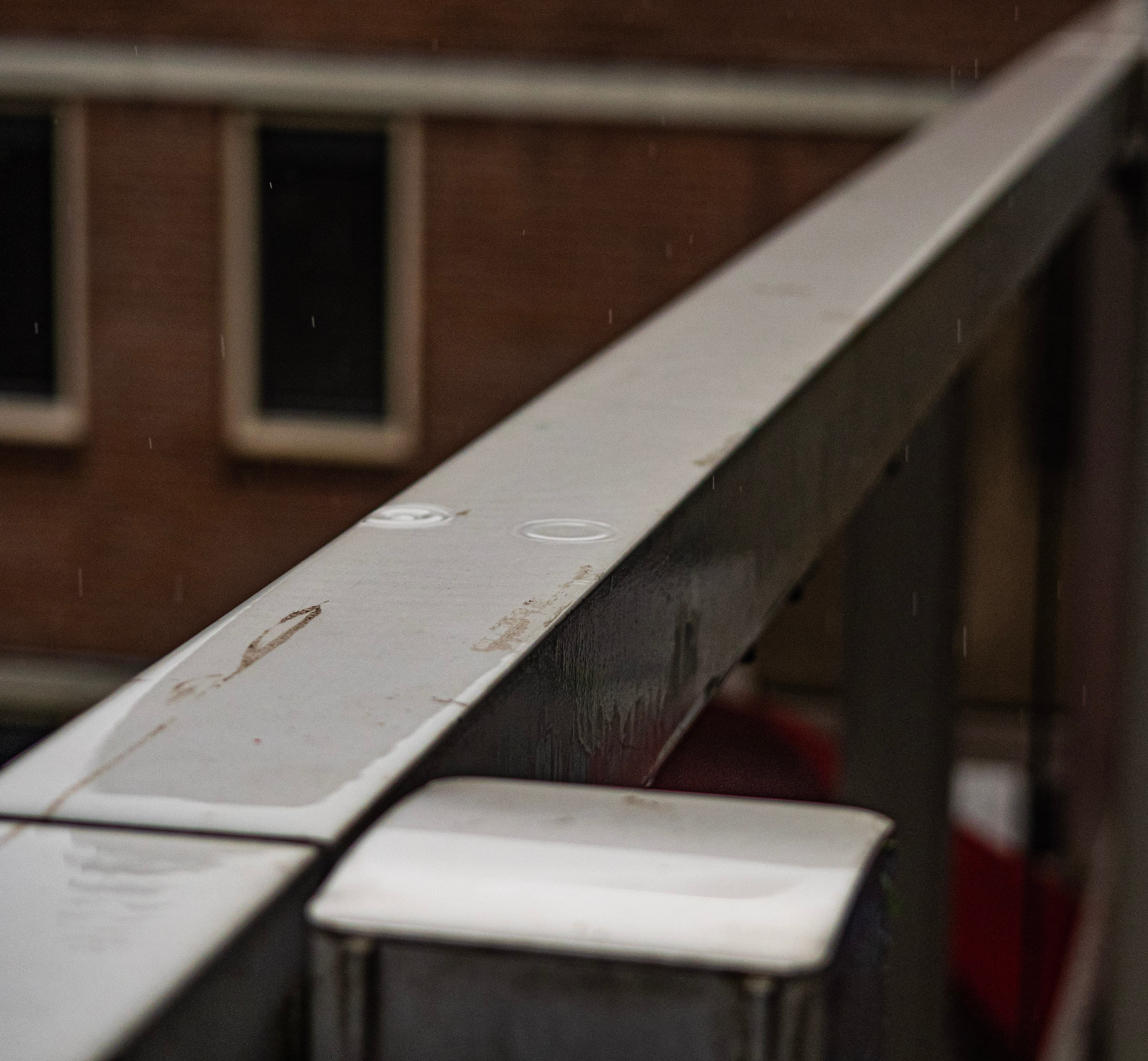 Rain Drops on a Weathered Railing